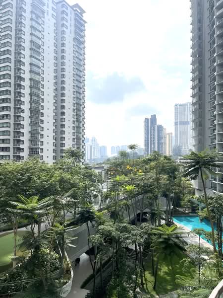 28 Mont Kiara: Outlook over landscaped podium gardens and a pool between two condominium towers, city skyline beyond