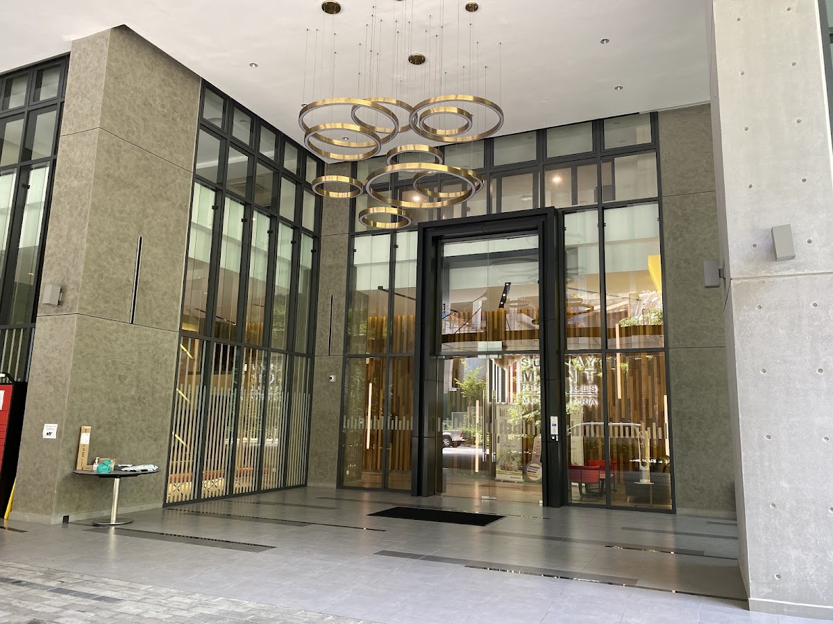 Sunway Mont Residences: the glazed lobby entrance under its ring chandeliers