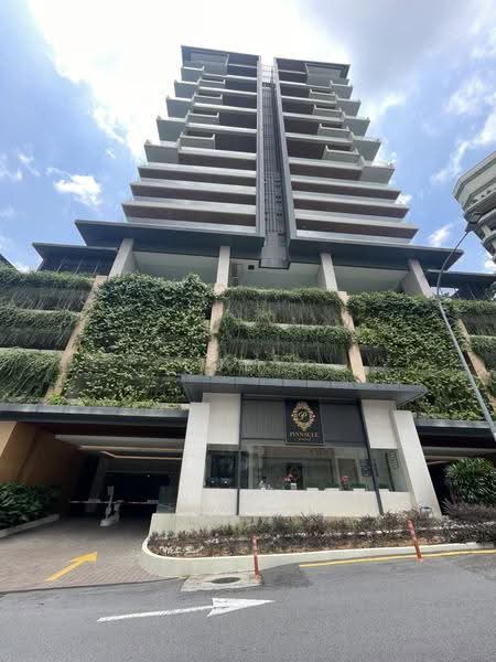 Pinnacle Bangsar: High-rise tower with planted green walls above a covered entrance driveway