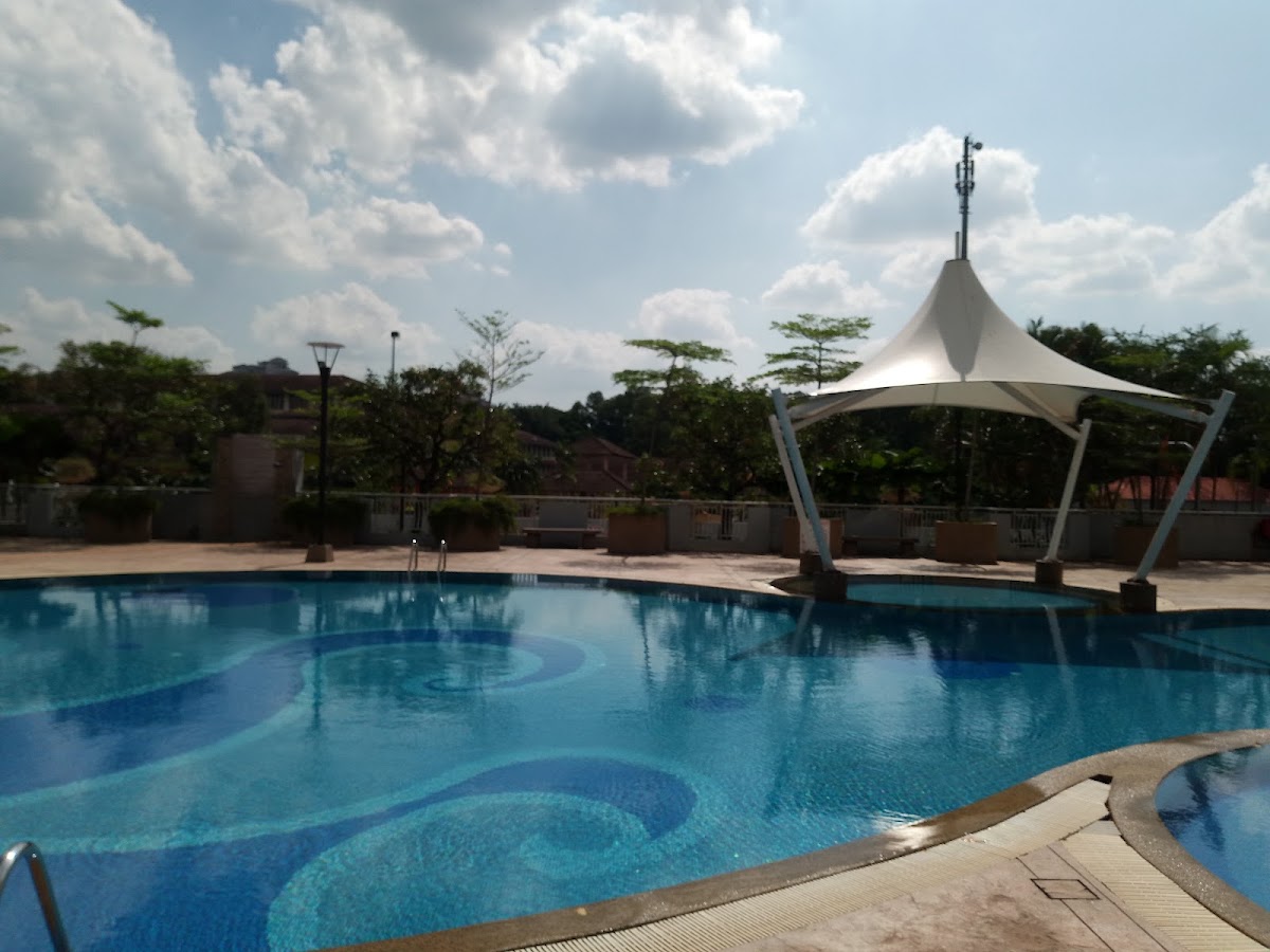 Pelangi Utama: the pool beneath its white canopy
