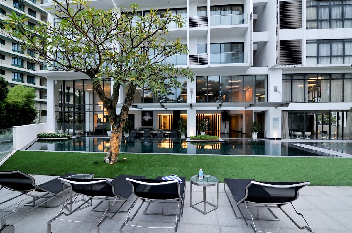 KEN Bangsar: the pool deck and loungers below the block