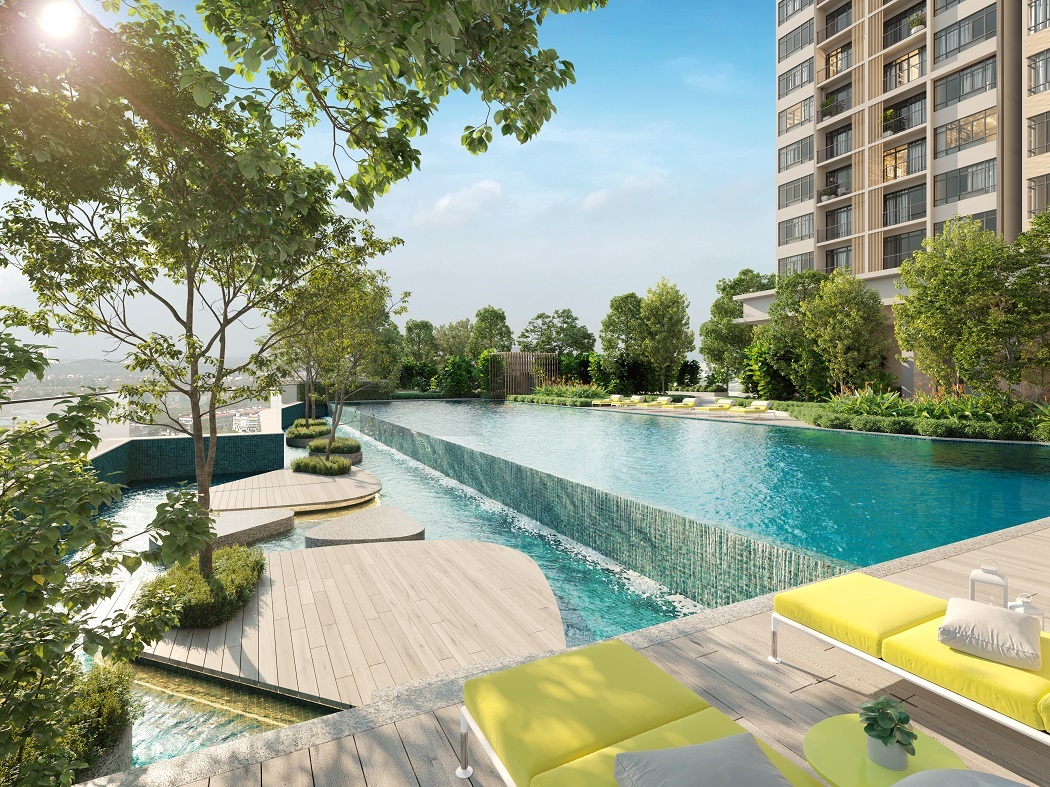 Artist's impression of River Park @ Bangsar South: outdoor pool with timber deck and yellow loungers beside tower