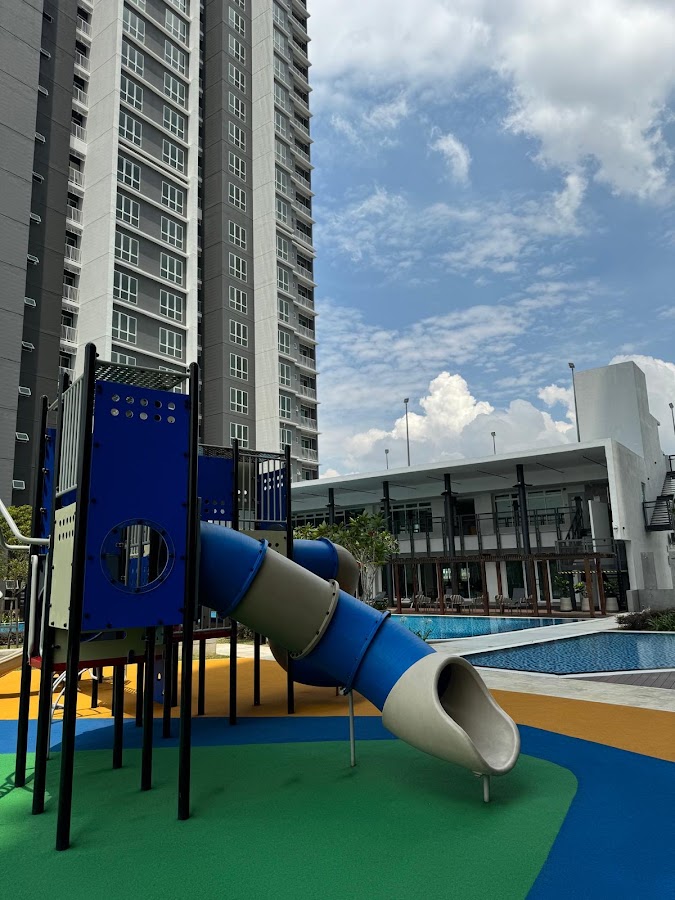 121 Residences: the children's playground beside a tower