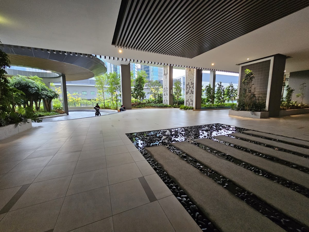 Laurel Residence: the ground-floor lobby beside a stepping-stone water feature
