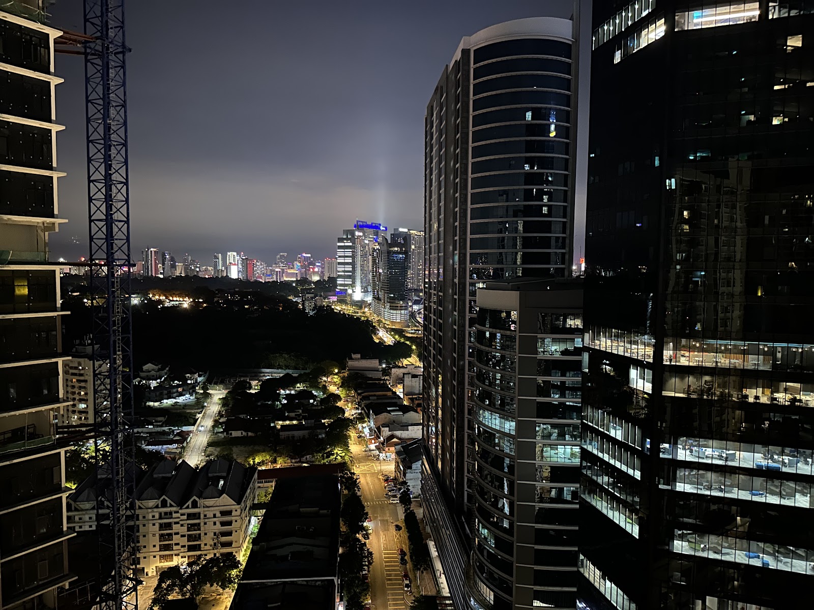 Gaya Bangsar: Night-time city skyline view from a high-rise unit, showing surrounding towers, streets, and cityscape in the distance