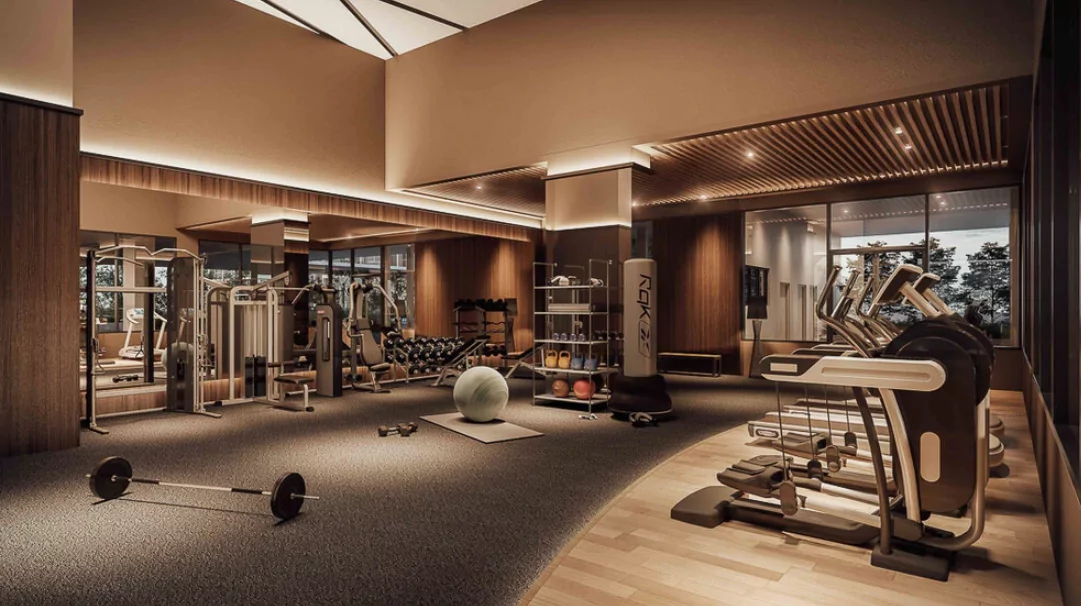 Artist's impression of Solasta Dutamas: gym with free weights, cable machines, a punch bag and a row of cross-trainers by a glazed wall