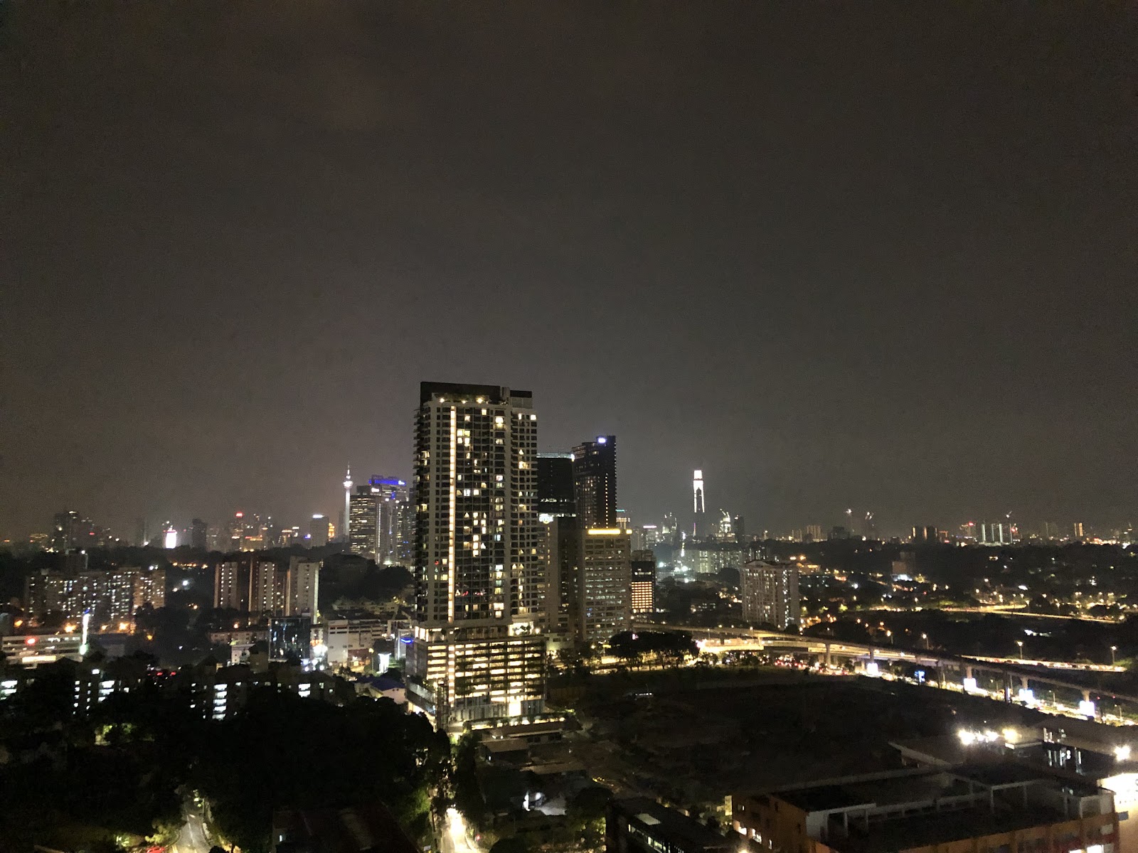 Suasana Bangsar: Night skyline view of city towers and lights seen from a high floor of the development