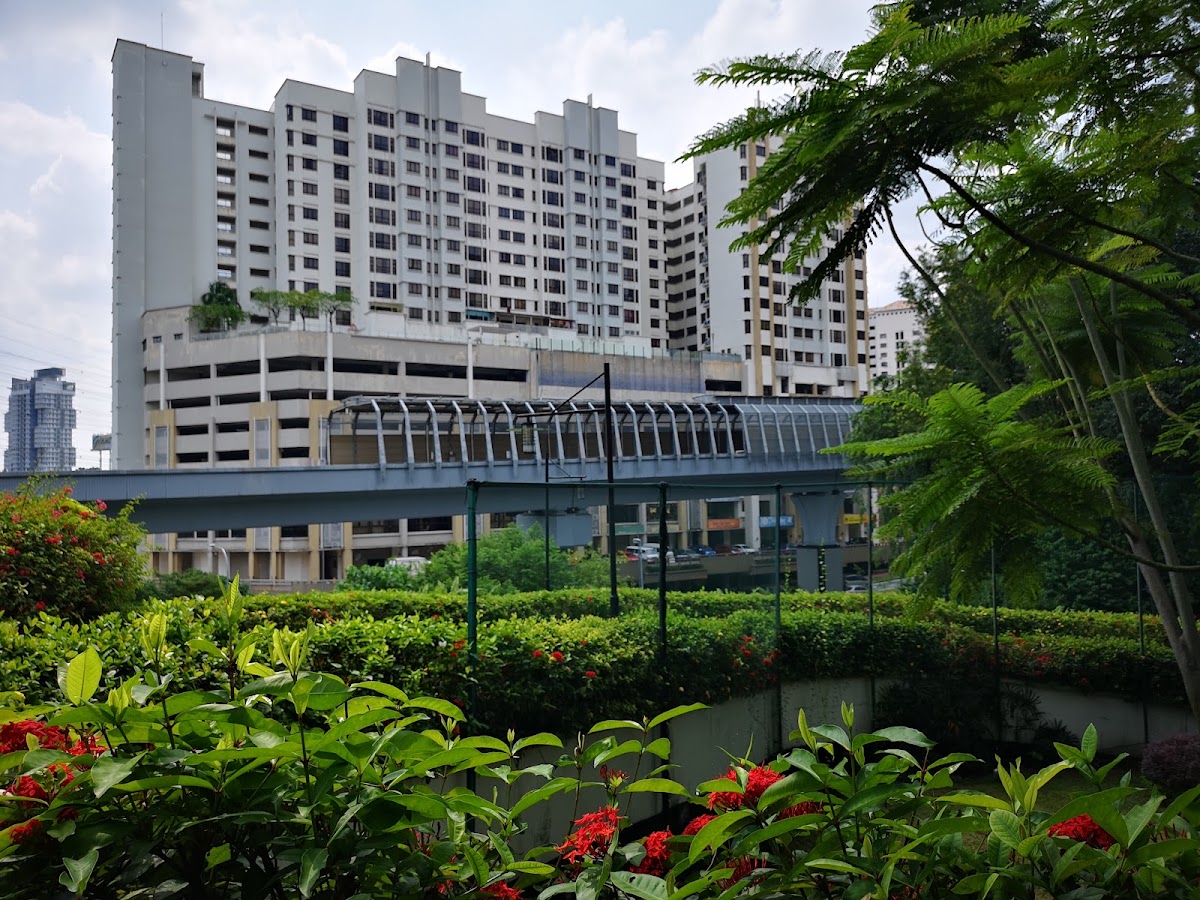 Serviced Residence @ Pelangi Damansara Sentral: the blocks above the car-park podium, behind a landscaped slope