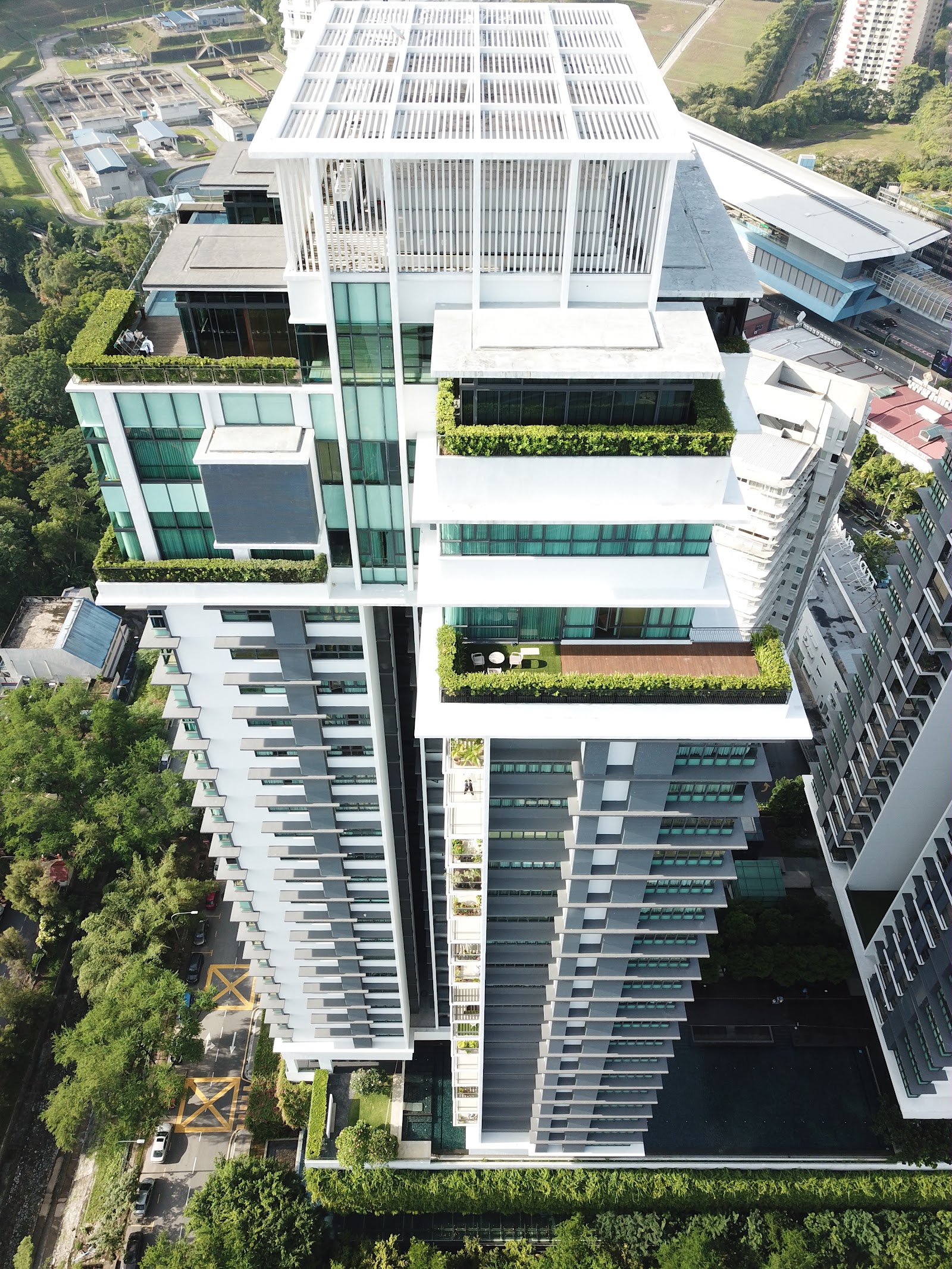 The Residence Condominium @ TTDI: Aerial view of a modern residential tower showing its facade, sky terraces with greenery, and layered balcony structure