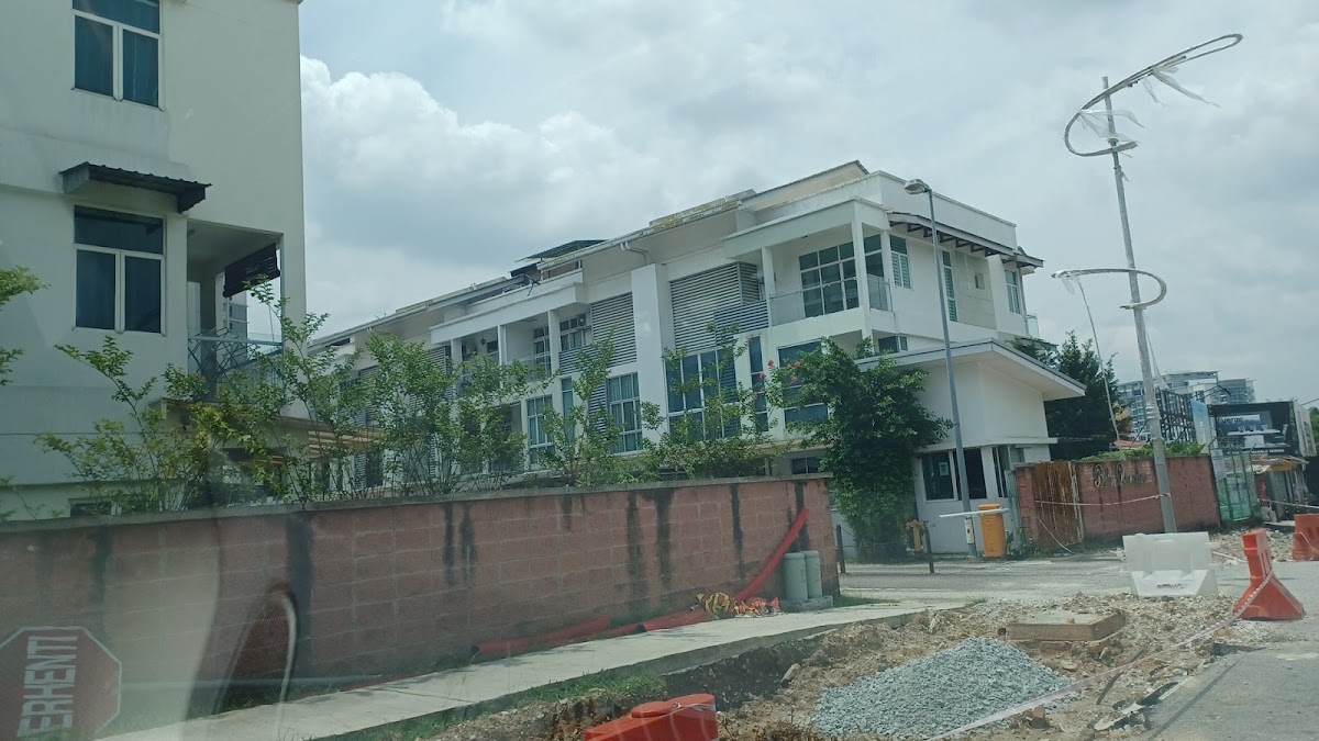 Bella Damansara: three-storey houses behind the boundary wall, with road works in front