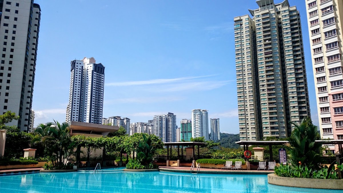 Mont Kiara Bayu: the pool among palms, towers beyond