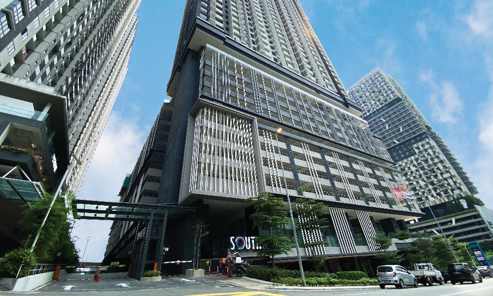 South Link Lifestyle Apartments: the towers from the street, above the podium's entrance