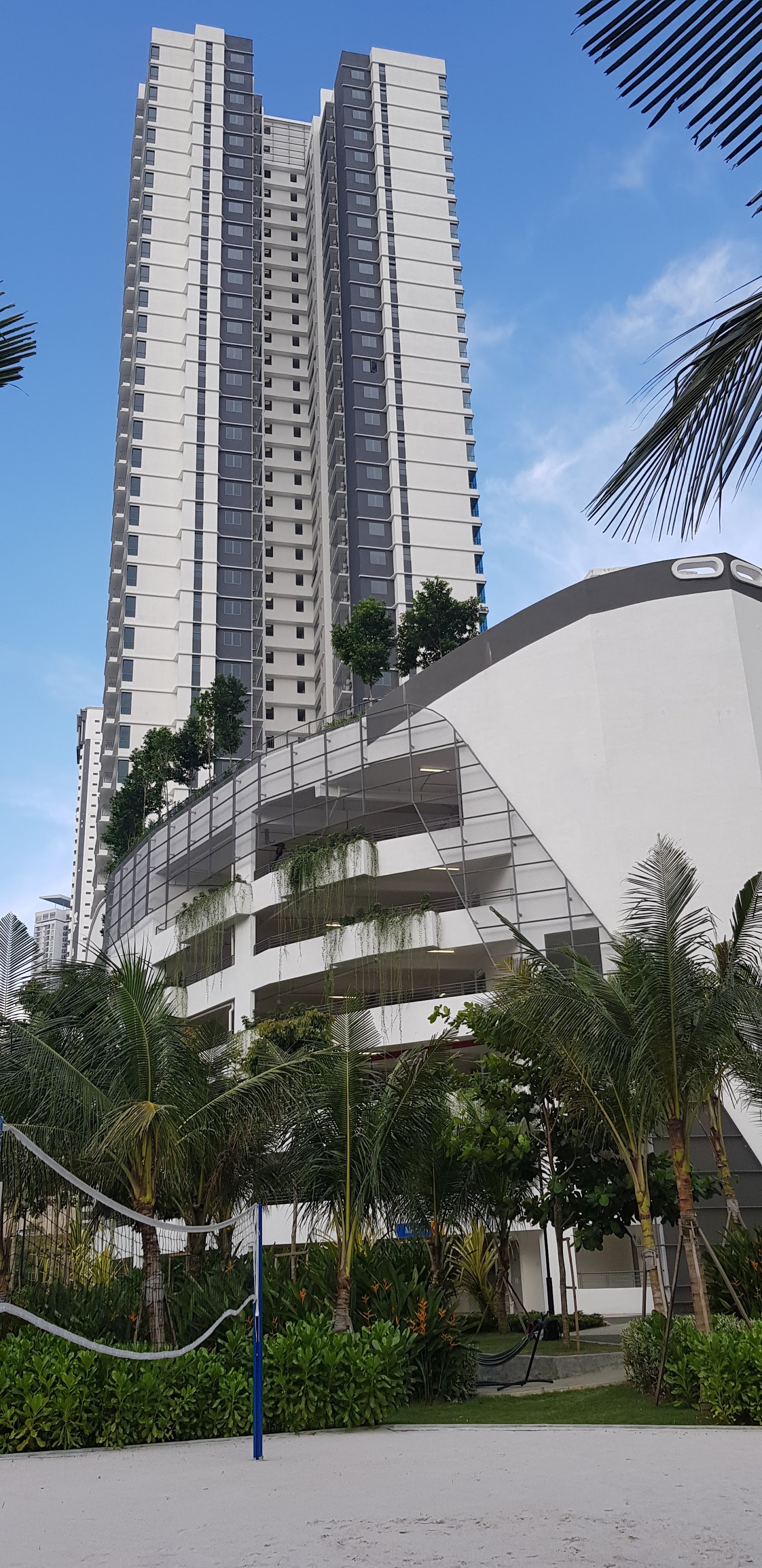 Residensi Sefina Mont Kiara: High-rise residential towers with landscaped grounds, palm trees, and a parking podium with greenery-covered facade