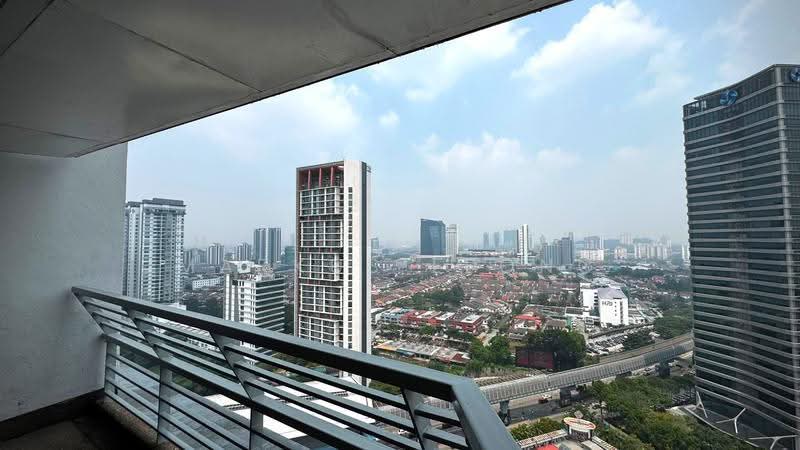 The Plaza Condominium: City skyline and low-rise rooftops seen over a balcony railing