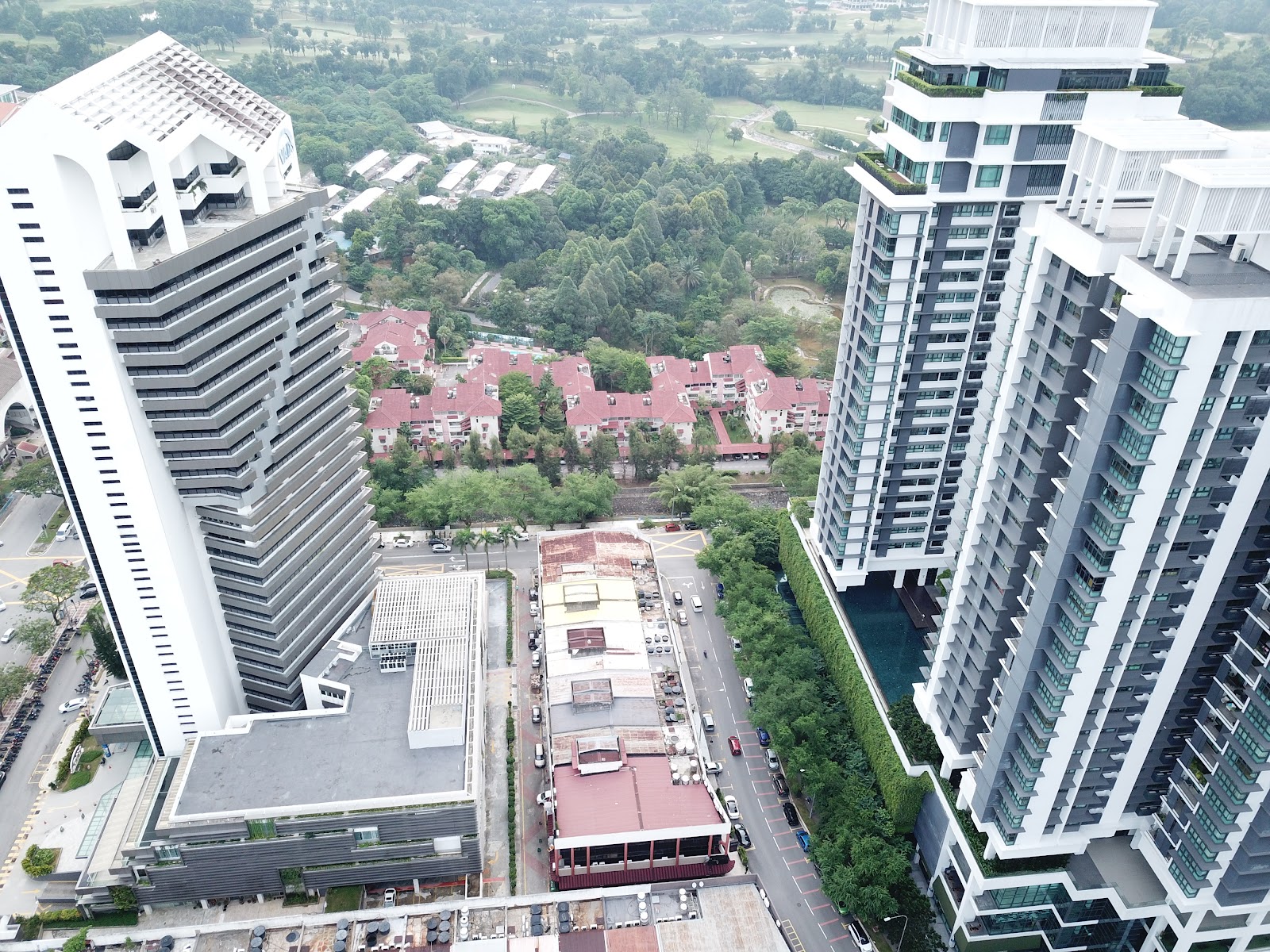The Residence Condominium @ TTDI: Aerial view of high-rise condominium towers with surrounding low-rise red-roofed housing, greenery, and city roads