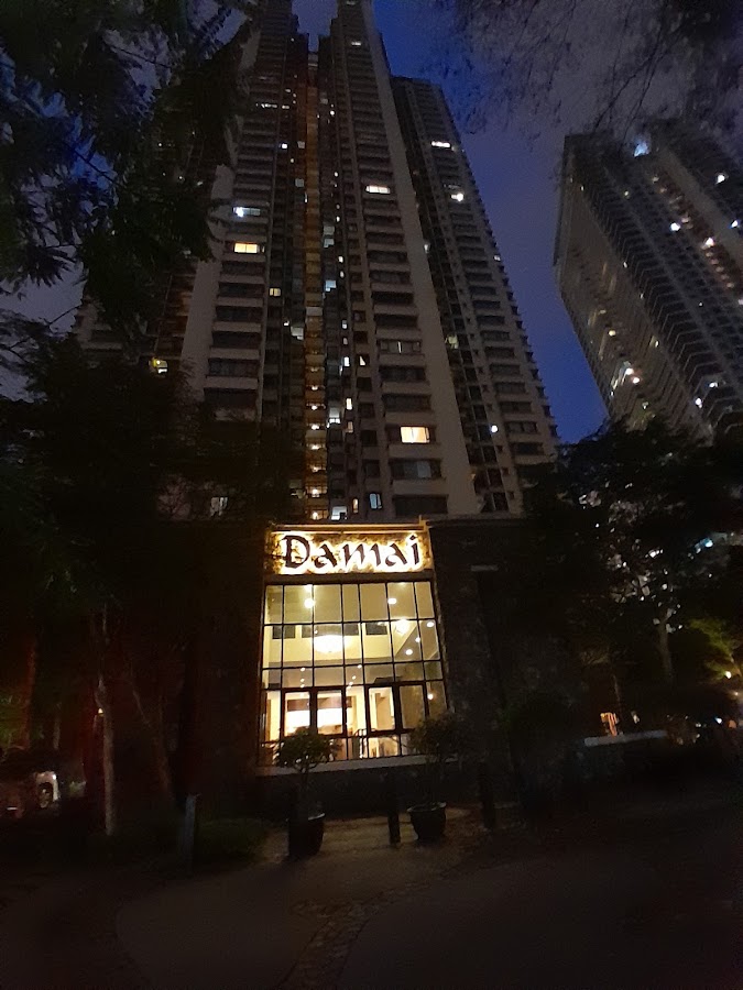 Mont Kiara Damai Resort Condominium: the lit Damai entrance below the towers at night