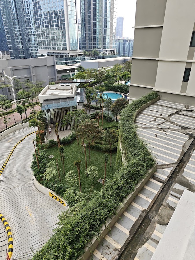 The Goodwood Residence: the curving entrance ramp and landscaped grounds from above