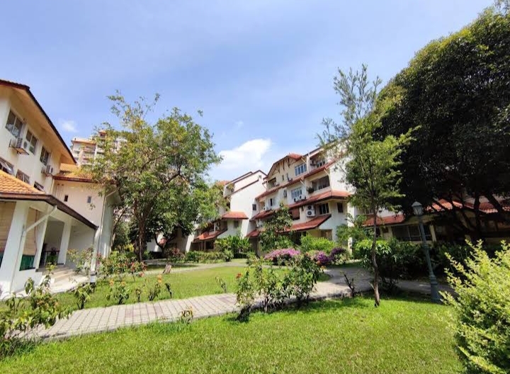 Villa Flora: Low-rise residential blocks with terracotta roofs surrounded by lush gardens, trees and pathways within a housing development