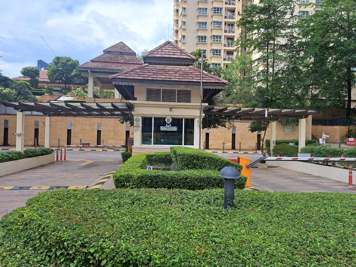 Mont Kiara Aman: the guardhouse and barrier, a tower behind