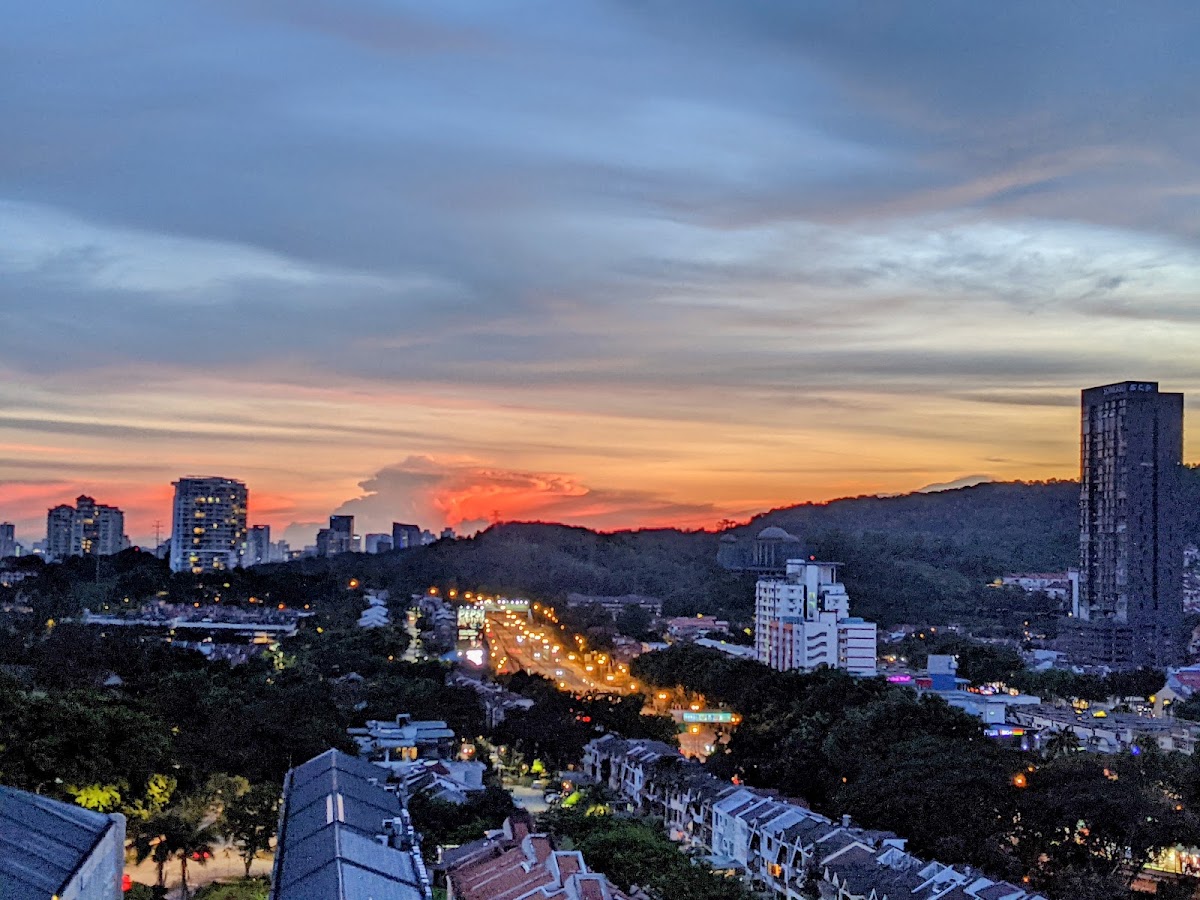 Dorchester Apartment: sunset over the neighbourhood and the hills from a high floor