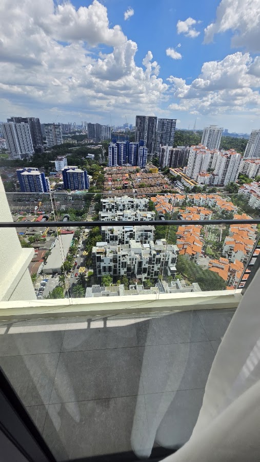 Laurel Residence: the view from a high floor over low-rise houses to the city