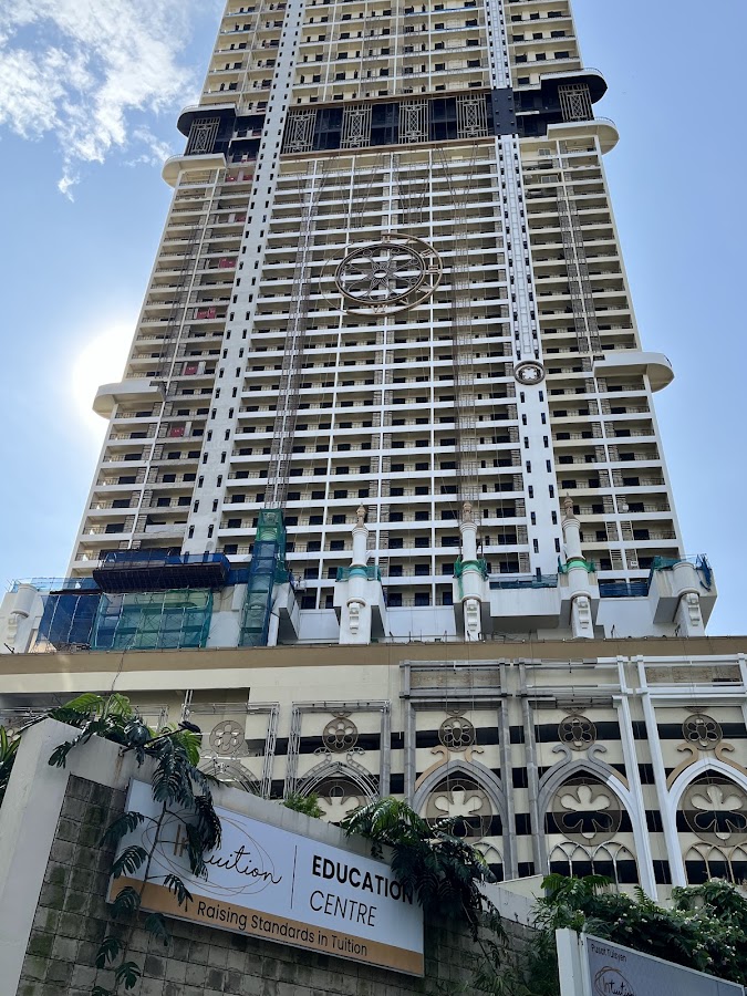 Arte Solaris Mont Kiara: the tower above its ornate podium, a tuition centre's signboard at its foot