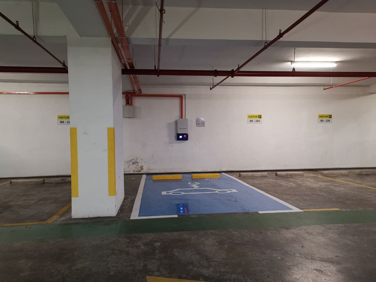 28 Mont Kiara: Basement parking area with a designated visitor and electric vehicle charging parking bay