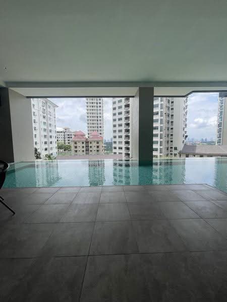 Pinnacle Bangsar: Infinity swimming pool and tiled deck under a shaded overhang, apartment blocks beyond